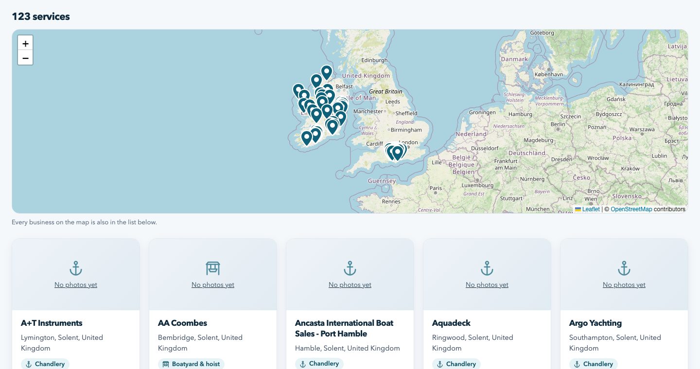 Screenshot: the marine services directory with category chips, a map and business cards
